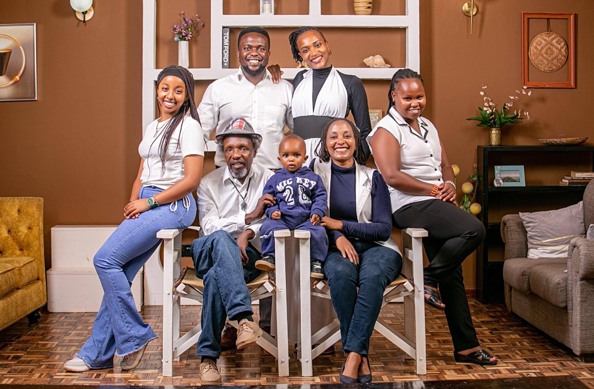My extended family — dad and mum in front with Leo in between them, my sister on my dad's right, me and my wife in the back, and our nanny on my mum's left.